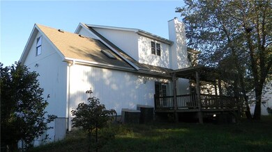 NW CORNER WITH THE WEST SIDE DECK & THE NORTH SIDE
