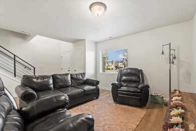 Living room & entry way featuring LVP - some people choose to finish this space into a 4th bedroom