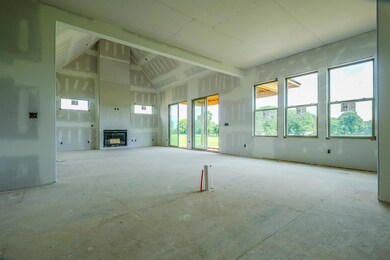 Open, airy floorplan with lots of natural light. 2-story greatroom opens to kitchen.