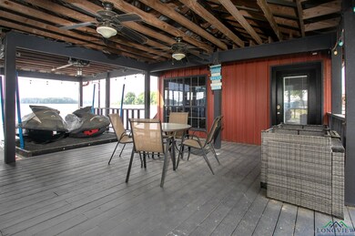 Deck featuring outdoor dining area and a ceiling f