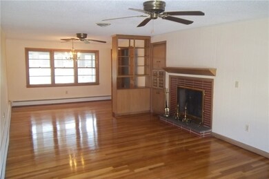 Front to back living room with brick fireplace