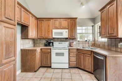 Bright kitchen with double sink and nice amount of cabinets