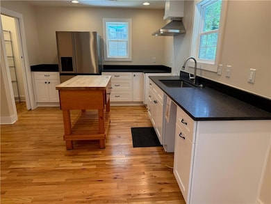 The new appliances will be installed when the lease is signed.That includes a dishwasher, stove and oven, as well as a microwave. The walk in pantry is to the left of the refrigerator.