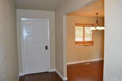Formal entry area, opening to dining nook & kitche