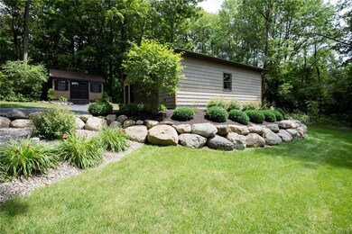 Side of 2.5 car garage and shed