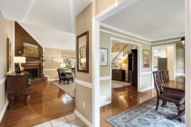 Hall featuring a textured ceiling, lofted ceiling,