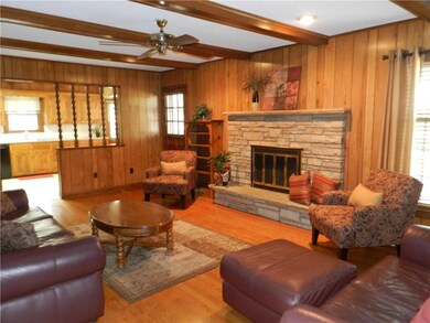 Main level family room with hardwood floors and wo