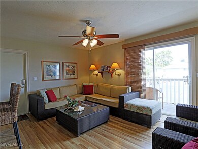 Living room with light wood-style flooring, a ceil