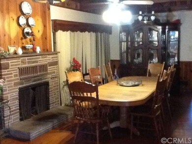 Dining Room with wood burning fireplace and hardwo