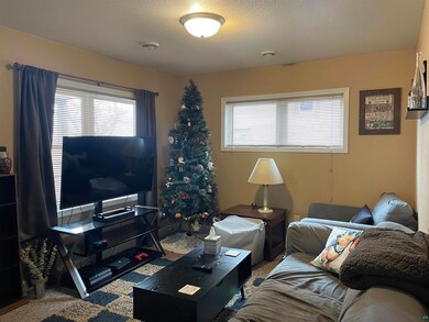 Living room featuring carpet flooring and a textur