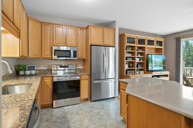 Silestone counters, stainless steel appliances and farm sink.