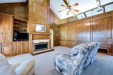 The family room has a beamed vaulted ceiling for a