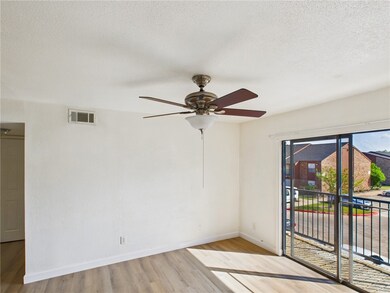 Spare room featuring light wood-type flooring, a c