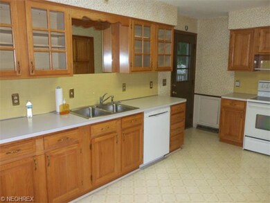Main Suite Kitchen with skylight and  man door to 