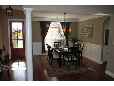 Formal dining room with more hardwood flooring.  V