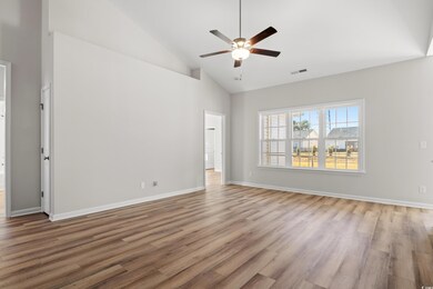 Unfurnished room with high vaulted ceiling, light 