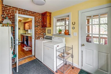 Nice size laundry room off of kitchen.  Screened in porch is through door.