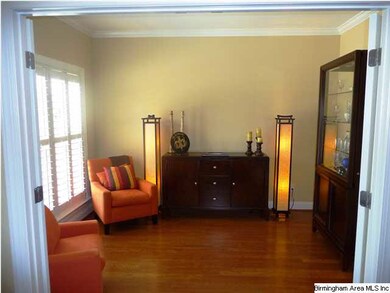 Formal living room/study with French doors.