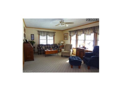 Living room has lots of natural light from the 5 w