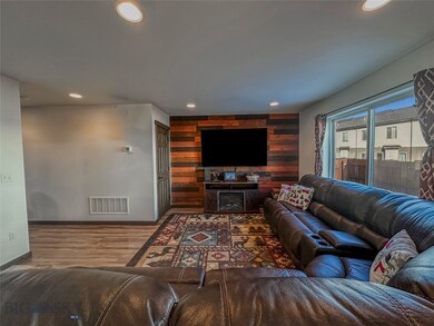 Living room with hardwood / wood-style floors and