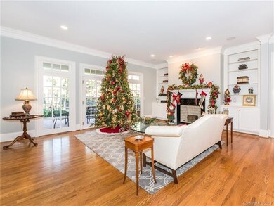 Formal living room with custom built-ins, fireplac
