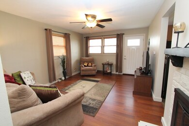 Nice size family room with fireplace.  Cherry tone