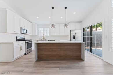 Kitchen featuring decorative backsplash, quartz co
