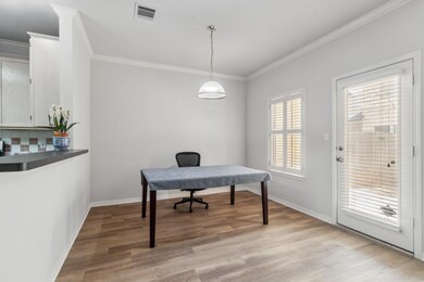 Office space with baseboards, ornamental molding,