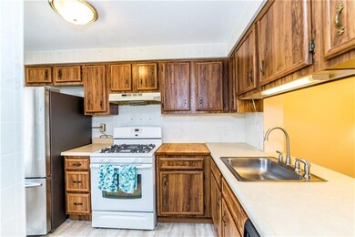 The kitchen has brand new flooring & a ceiling to 