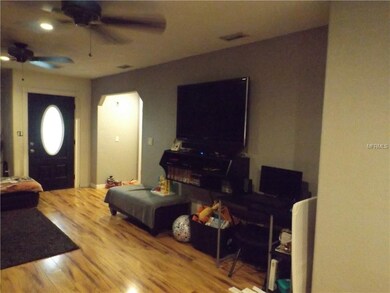 Other view of living room with mounted TV.