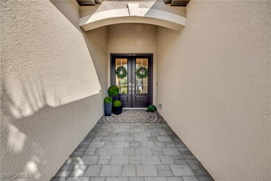 Property entrance featuring french doors