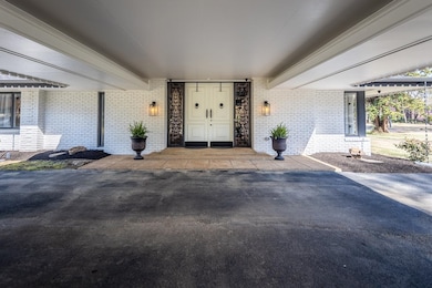 Property entrance featuring brick siding