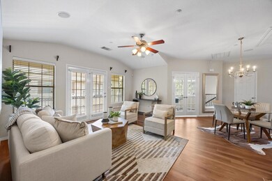 Living area featuring a chandelier, wood finished
