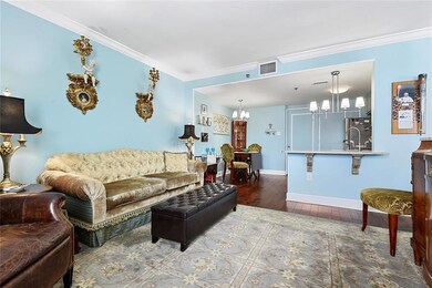 Den with Crown Molding and Wood Vinyl Flooring