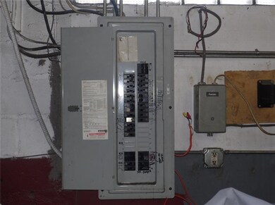 There are 2 breaker boxes in the garage and one ne
