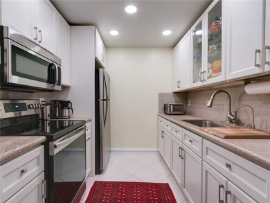 Updated kitchen with stainless steel appliances, a