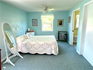 master bedroom with full bath with pocket door and