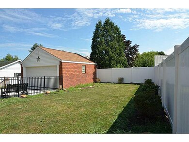 Parking Lot/Garage. Fenced Rear Yard