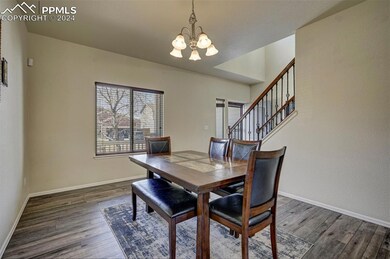 Dining room featuring dark wood-type flooring and 