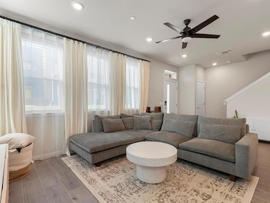 Living room featuring recessed lighting, wood fin