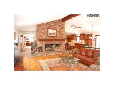Great Room features a large brick raised hearth ga