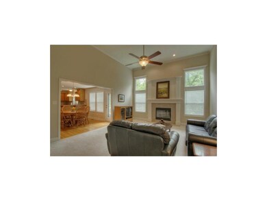 Living room includes a gas fireplace, ceiling fan 
