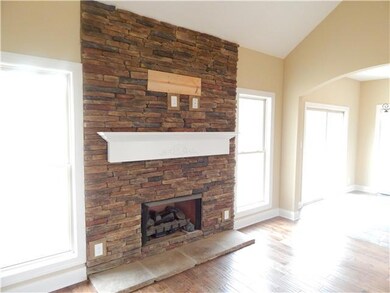 Gorgeous stone work on fireplace to include flagstone hearth and decorative mantel.  