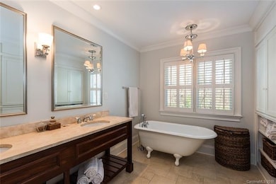 Master bath with storage cabinets and shelves and 