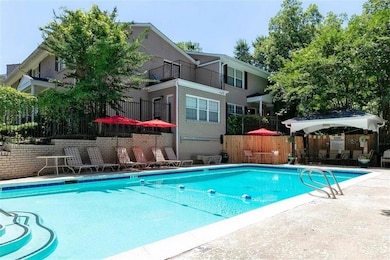 Community pool featuring a patio