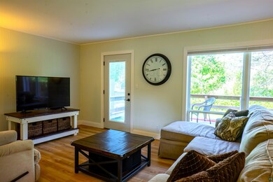 Living room with hardwood / wood-style flooring