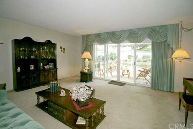 Living room overlooking the patio and gorgeous par