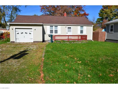 Entry doors to living room and garage are at the f
