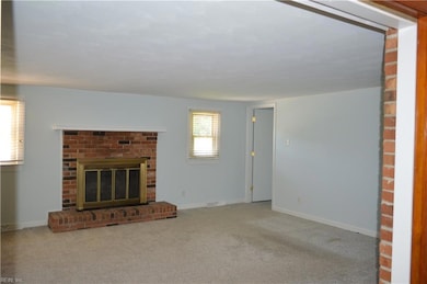 Family room w/ wood burning fireplace