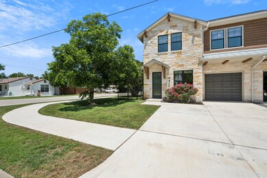 View of front of house featuring stone siding, an